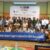 Participants of the conference is holding a long banner with "Our Disabilities Movement Support to Implement the ASEAN Masterplan 2025" written on it.